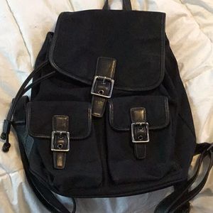 Canvas and leather Coach backpack purse.